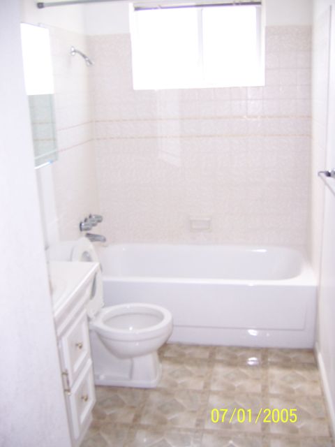 1991 Ford Bronco - A dated bathroom scene shows a toilet, sink, and bathtub with a timestamp of July 1, 2005.