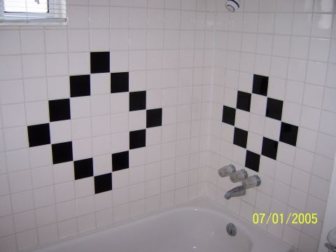 1991 Ford Bronco - A bathroom scene with a bathtub and tiled walls, dated 07/01/2005.