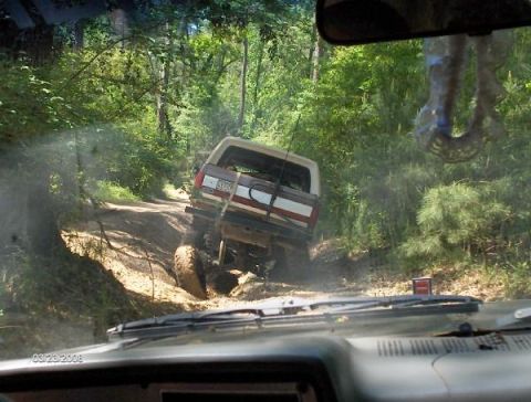 1987 Ford Bronco - This 1987 Ford Bronco navigates a muddy, wooded trail.