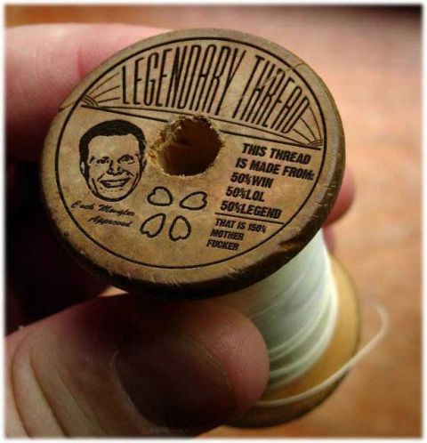 1995 Ford Bronco - A wooden spool of thread is held, displaying text about its composition and a humorous illustration.