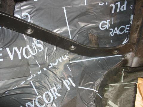 1978 Ford Bronco - Black plastic sheeting with 'VYCOR' and 'GRACE' text is installed on the interior floor of a vehicle.