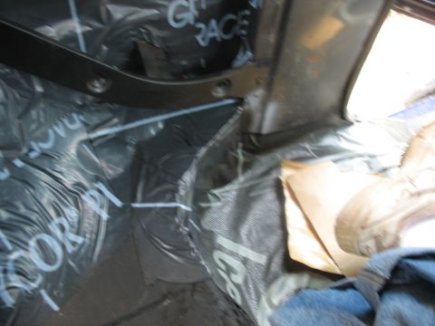 1978 Ford Bronco - Sound deadening material being installed inside a vehicle's interior.