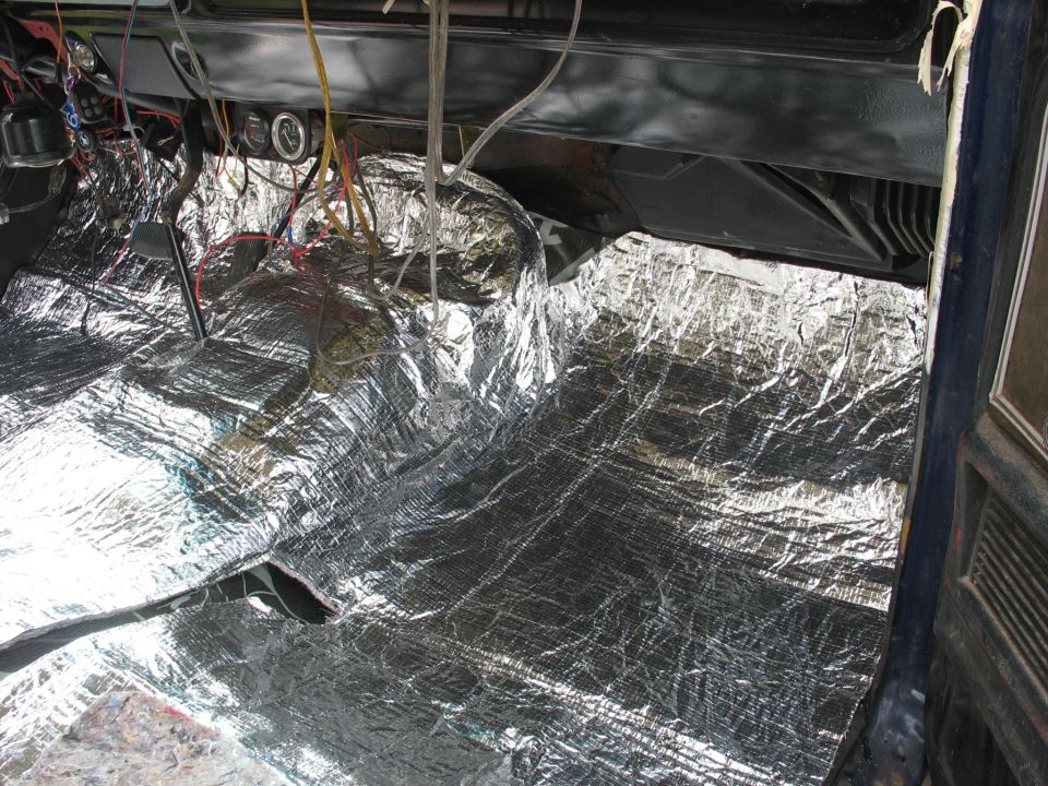 Interior soundproofing installation with exposed wiring and gauges