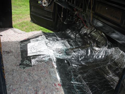 1978 Ford Bronco - Sound deadening and carpet padding are being installed on the floor of a vehicle's interior.