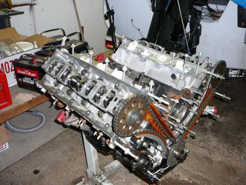 1997 Mercury Grand Marquis - Engine block assembly on a stand, showing internal components and timing chains.