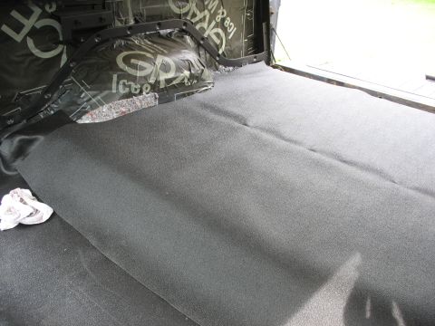 1978 Ford Bronco - Sound dampening and carpeting are being installed in the interior of a vehicle.