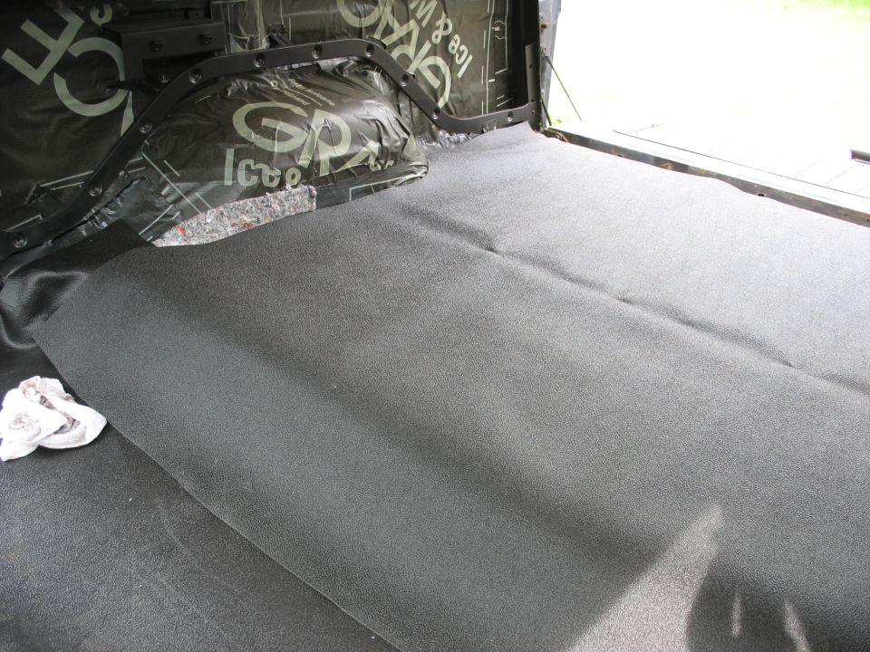 Interior of vehicle with sound dampening and new carpet installed