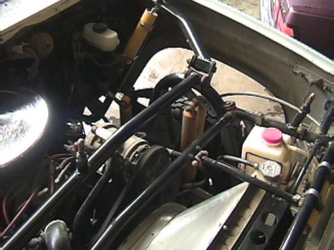 1984 Ford Bronco - Close-up view of the engine bay, showing various components and modifications.