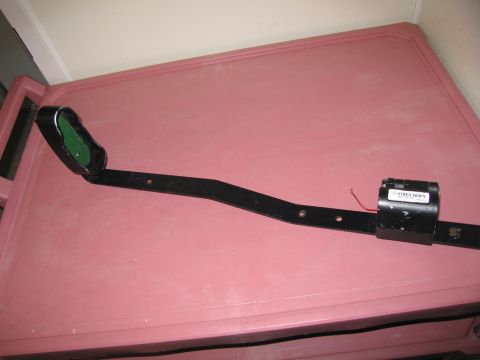 1991 Ford LTD Crown Victoria - A black metal automotive part, possibly a bracket or sensor mount, is shown with a label that reads 'STREET HAWKS'.
