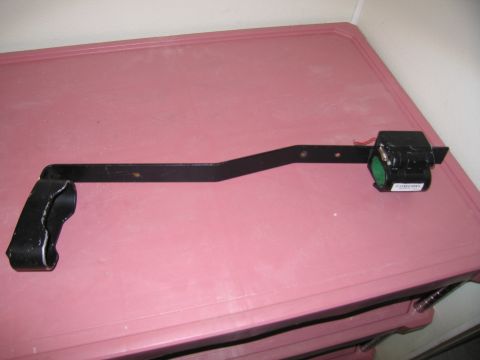 1991 Ford LTD Crown Victoria - A black metal bracket with an attached electrical component is displayed on a pink surface.