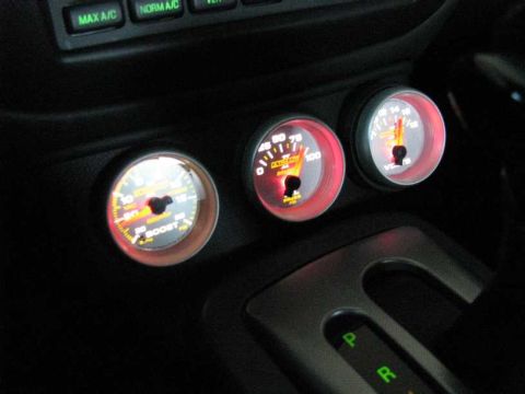 2003 Mercury Marauder - Aftermarket gauges for boost, pressure, and voltage are installed in the vehicle's interior.
