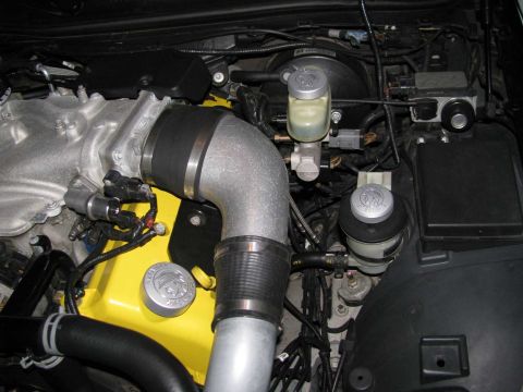 2003 Mercury Marauder - Close-up view of an engine bay, showing various components and wiring.