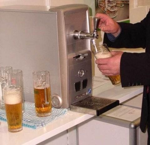 1991 Ford Bronco - A person is serving beer from a unique dispenser, with several glasses of beer ready to be enjoyed.