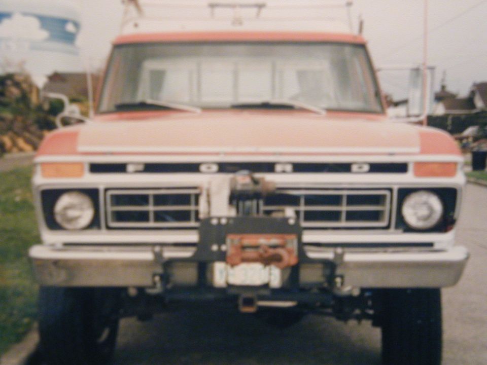 Front view of a 1970s Ford pickup with FORD grille lettering and a winch