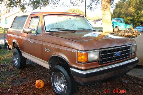 1989 Ford Bronco - This 1989 Ford Bronco is parked outside with a second vehicle in the background.