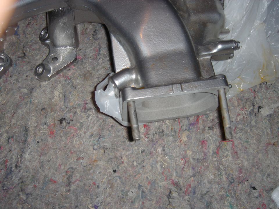 Refinished cast intake manifold with flange and studs