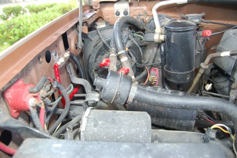 1989 Ford Bronco - Close-up view of engine bay components, including hoses and wiring.