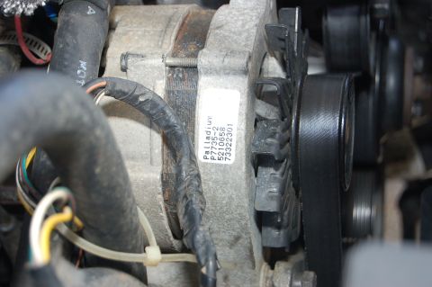 1989 Ford Bronco - Close-up of an alternator, identified by a Palladium label with part number P7735-2 and other numbers.