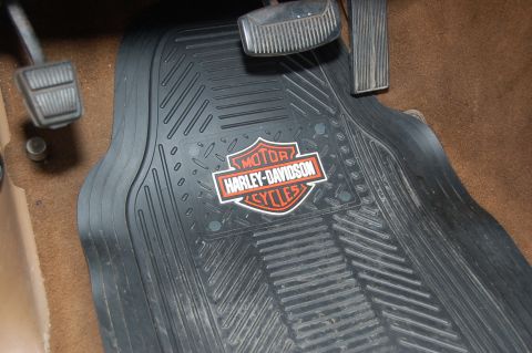 1989 Ford Bronco - A black rubber floor mat with the Harley-Davidson Cycles logo is shown in a vehicle's interior.