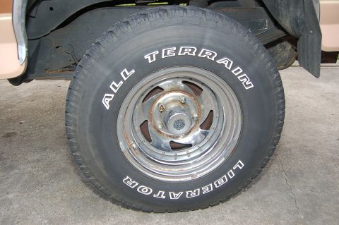 1989 Ford Bronco - Close-up of a tire and wheel assembly on a vehicle.