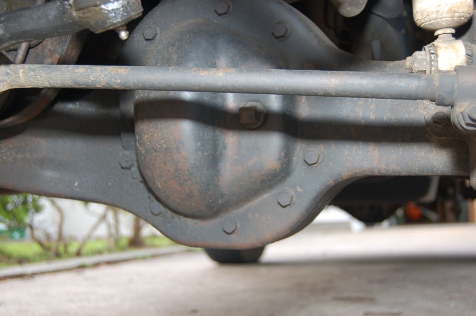 Rear axle differential housing with tie rod and suspension components visible