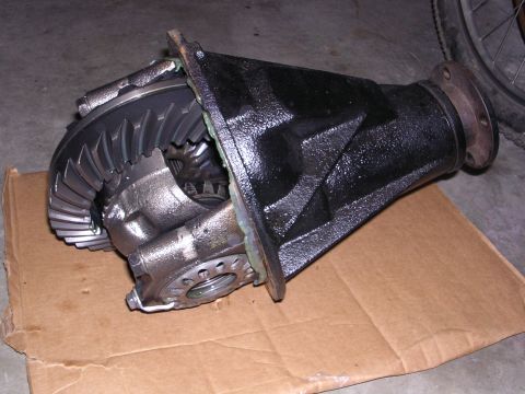 1983 Ferrari Enzo - A disassembled differential unit is shown, with its internal gears and housing clearly visible.