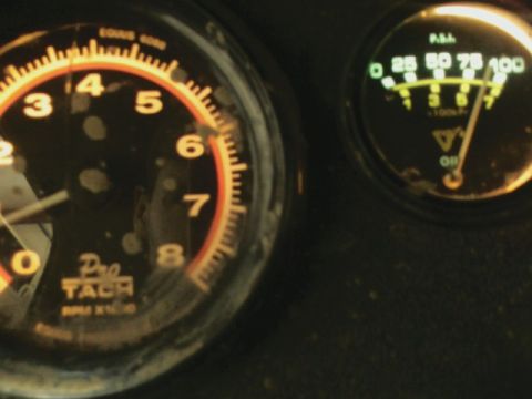 1992 Ford F-350 - Close-up of vehicle gauges, including a tachometer and oil pressure indicator.