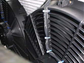2007 Ford Mustang - The radiator fan assembly is shown in a close-up view, highlighting its components and construction.