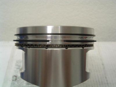 2007 Ford Mustang - This is a close-up view of a piston, a critical engine component, with its rings installed.