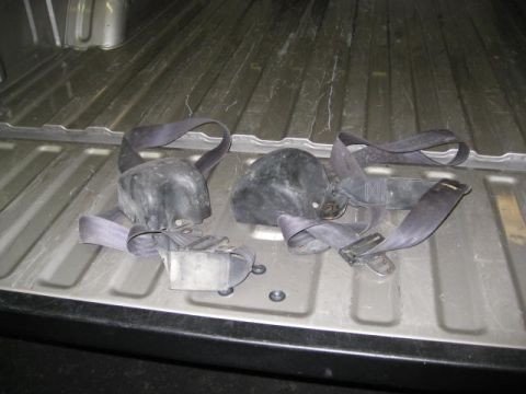 1994 Jeep YJ - Two seat belts are shown in the bed of a truck, not a 1994 Jeep YJ.