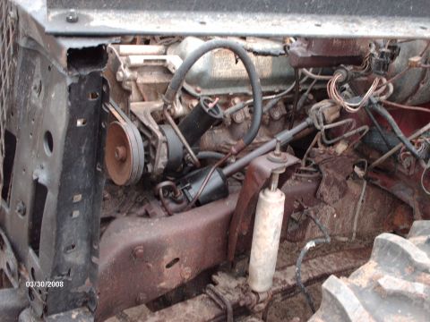 1982 Ford F-100 - Close-up view of a vehicle's engine bay with various mechanical parts and wiring.