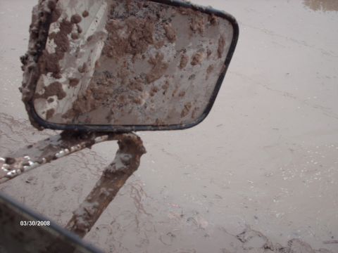 1982 Ford F-100 - Side mirror covered in mud, reflecting a muddy environment. Date stamp reads 03/30/2008.