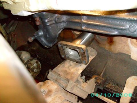 1979 Ford F-150 - Close-up of an exhaust manifold and a newly installed pipe section.