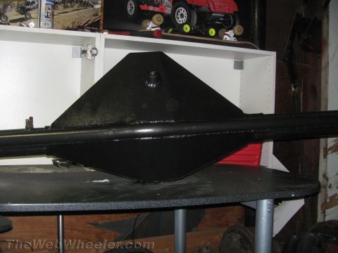 1968 Ford Mustang - A black painted rear axle assembly is displayed on a table, with a triangular differential housing visible.