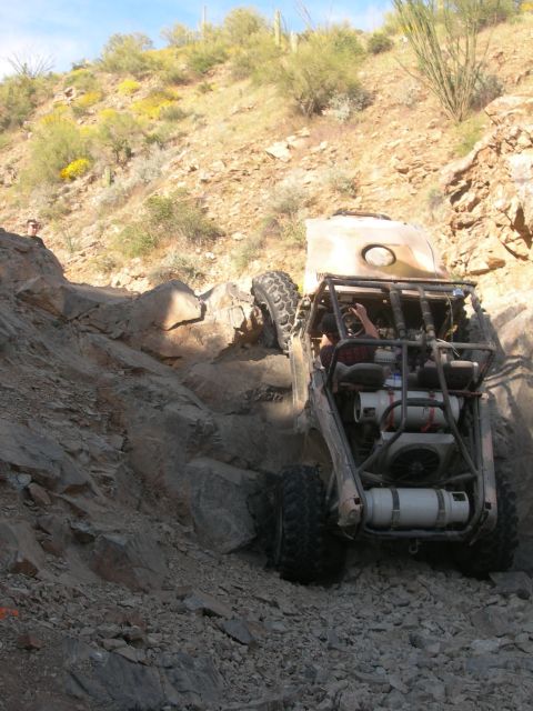 1974 Ford F-250 - Custom off-road buggy navigates a steep, rocky incline during an off-road excursion.