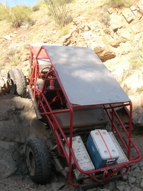 1974 Ford F-250 - Off-road buggy with coolers loaded, tackling a rocky trail.