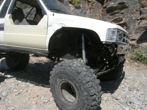 1974 Ford F-250 - This heavily modified 1989 Toyota pickup truck features oversized tires and a lifted suspension, ready for terrain.