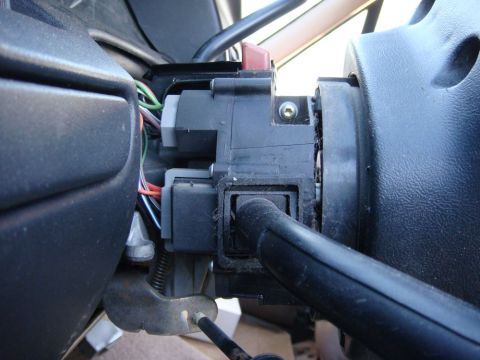 1996 Ford Bronco - Steering column signal switch assembly showing electrical connectors and wiring.