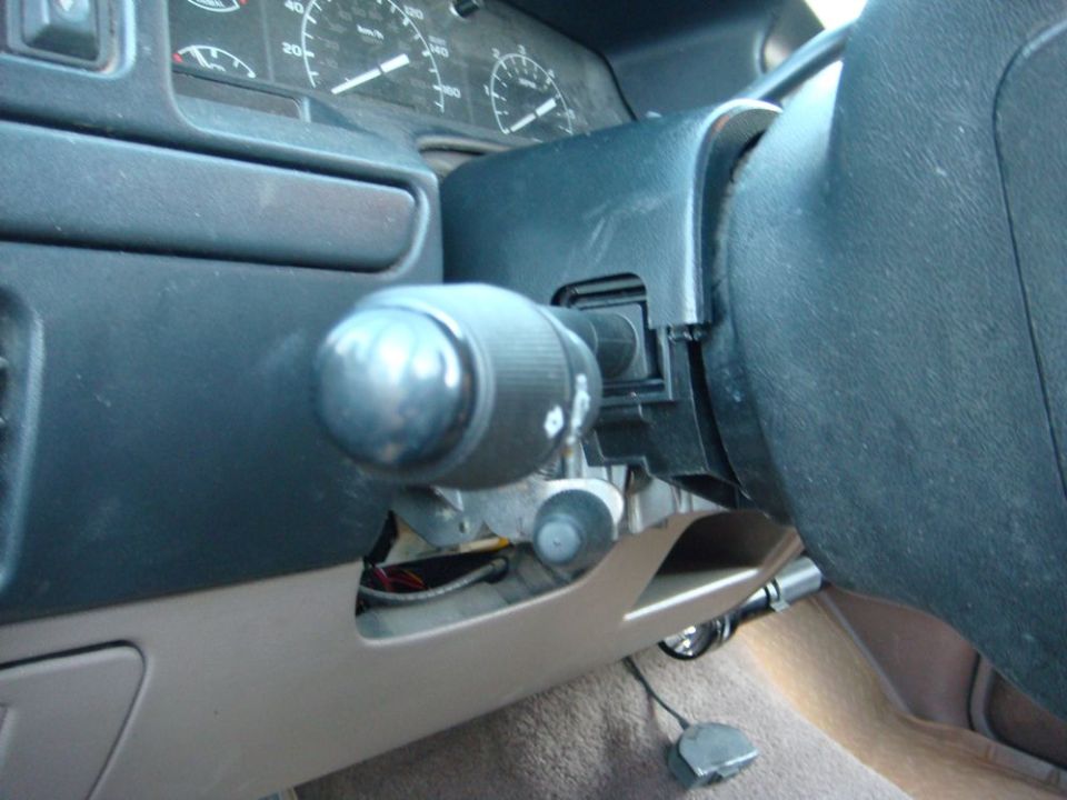 1996 Ford Bronco interior showing steering column, turn signal lever, and dashboard gauges