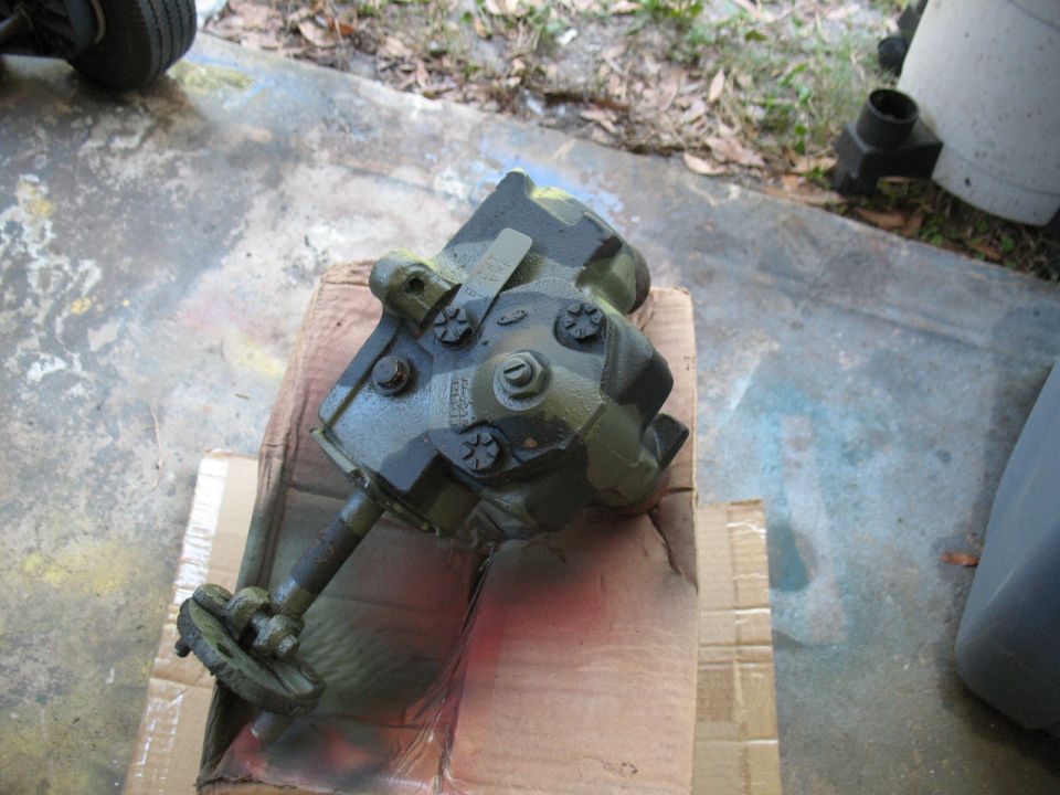 Green steering gear box with visible text on a cardboard box