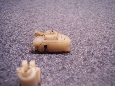 2007 Dodge Durango - A close-up view of a small, off-white plastic clip with visible dirt and wear.