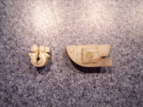 2007 Dodge Durango - Two white plastic automotive clips are shown against a speckled background.
