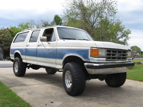 1995 Ford C-350 (Centurion Conversions) - This extended cab pickup truck features a two-tone paint scheme with a blue stripe.
