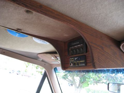 1995 Ford C-350 (Centurion Conversions) - Interior view of an overhead console with switches and a CB radio, labeled 'Centurion'.