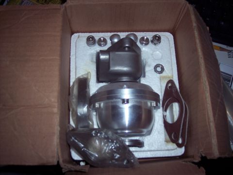 1995 Ford Probe - A blow-off valve, gasket, and bolts are packaged in a cardboard box.