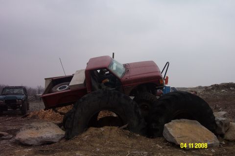 1992 Ford Bronco - Red 1992 Ford Bronco modified with large tires, seen with another off-road vehicle.