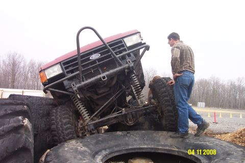 1992 Ford Bronco - This heavily modified Ford truck is stuck on large tires during an off-road event.