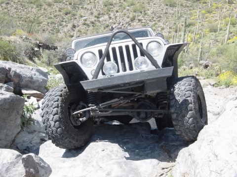 2004 Jeep Wrangler - This Jeep Wrangler navigates a challenging rocky terrain, its off-road capabilities.