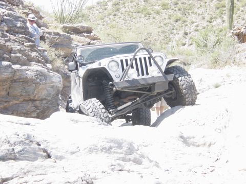 2004 Jeep Wrangler - A 2004 Jeep Wrangler tackles a challenging rocky trail, its off-road capabilities.