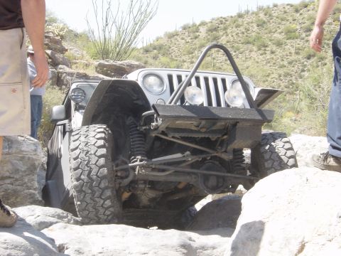 2004 Jeep Wrangler - Jeep Wrangler tackling a challenging rocky trail during an off-road excursion.